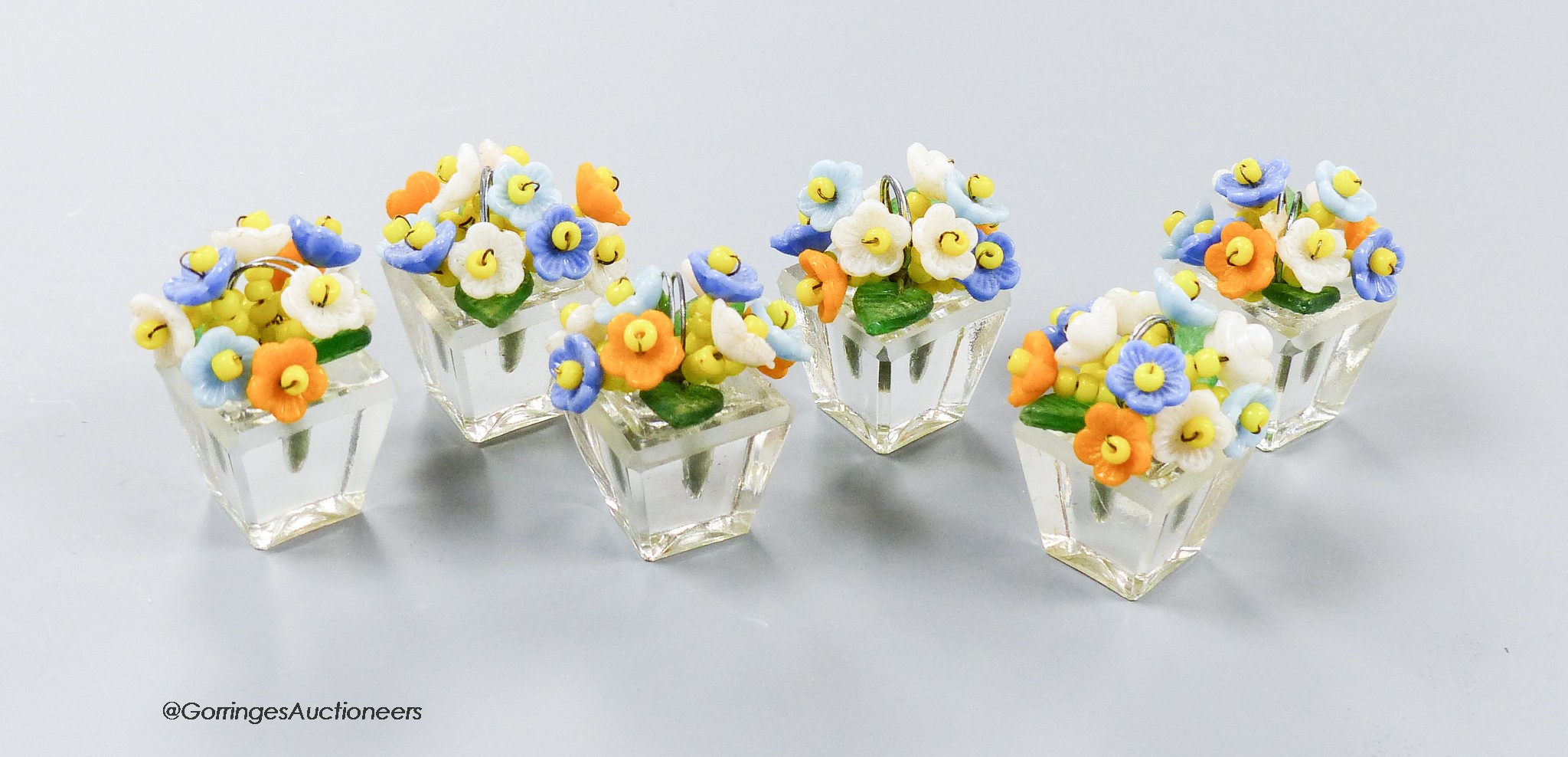 A boxed set of six Czechoslovakian glass flower menu holders, height 3.5cm